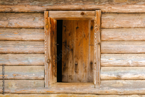 background - wooden door in the log wall
