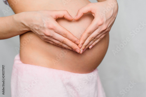Wallpaper Mural pregnant girl makes a hands love heart Torontodigital.ca