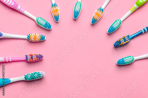 Toothbrushes on pink background