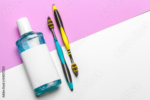 Flat lay composition with manual toothbrushes and oral hygiene product