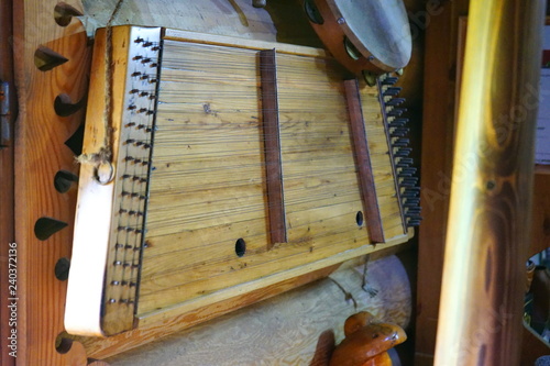 Old harp hanging on the wall Ancient musical instrument
