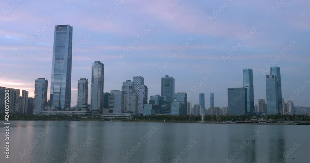 cityscape of buildings with sunset in shenzhen China,sea surface is smooth cityscape of buildings with sunset in shenzhen China,sea surface is smooth