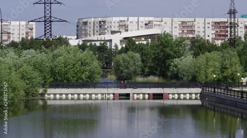 Surgut. View of the city - people on the bridge.  photo