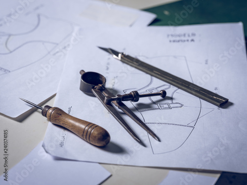 Shoe making tools lying on drafts photo