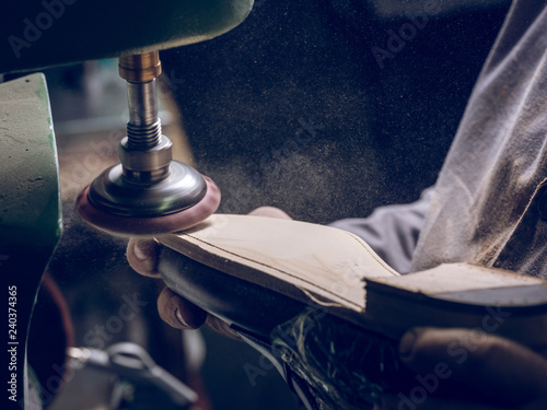 Crop shoemaker making sole on footwear