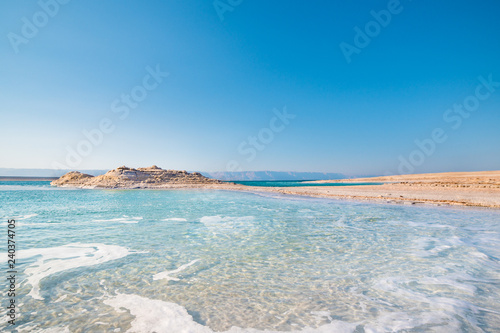 Amazing Dead Sea Beach. View of Dead Sea coastline. Salt crystals at sunset. Dead sea Israel, Jordan, Jerosolima.