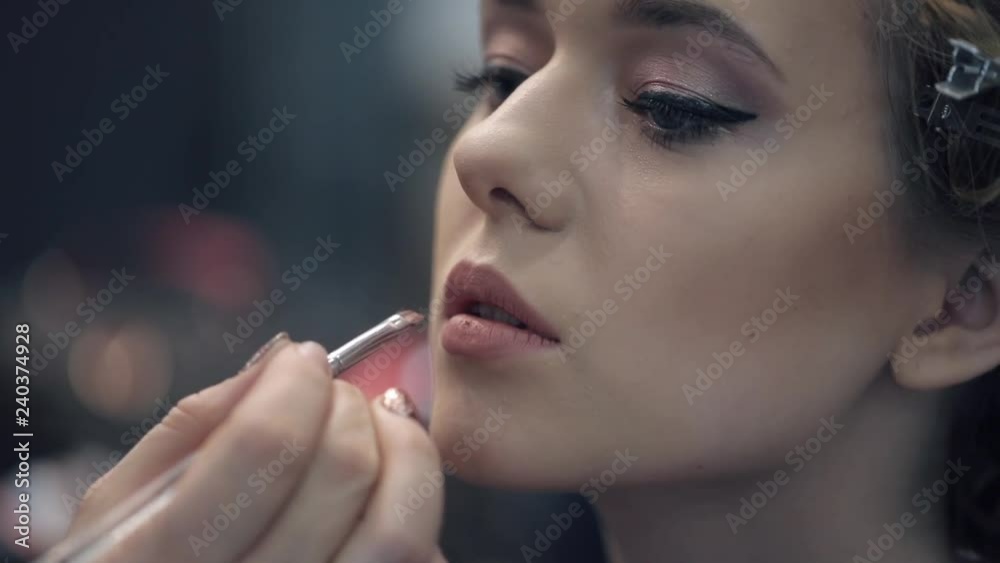 Makeup artist apply makeup to an attractive young women. Beauty Woman Make-up. Makeup artist apply makeup to an attractive young women. Beauty Woman Make-up.