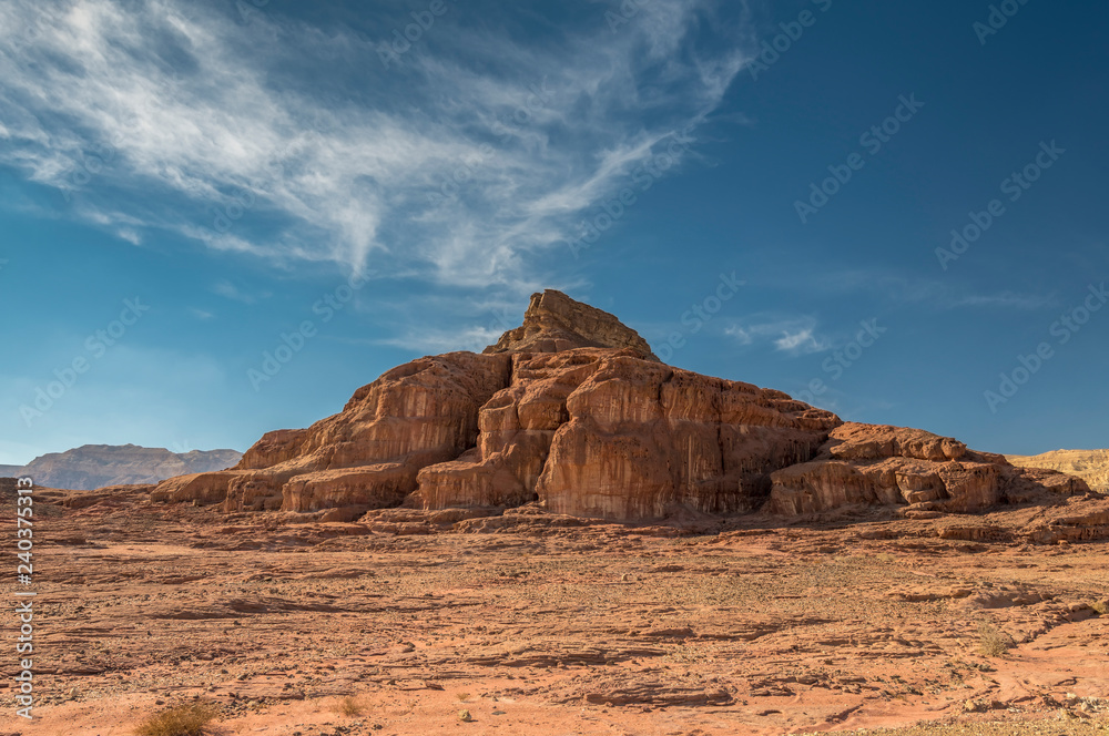 Volcanic landscape in national geological Timna park, Israel. It is located 25 km north of Eilat and combines beautiful scenery with unique geology, variety of sport and family activities
