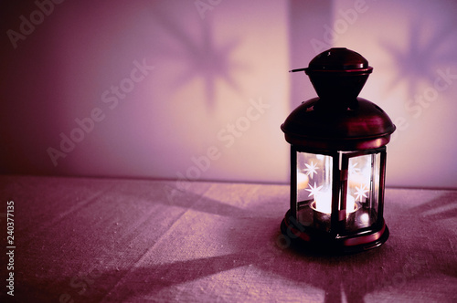 Candle in lantern, in shades of tropical summer