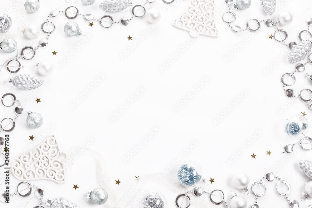 Christmas composition. Spruce branches, xmas tree, xmas silver decor holiday ball with ribbon on white background. Christmas composition. Spruce branches, xmas tree, xmas silver decor holiday ball with ribbon on white background.