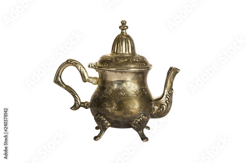 Vintage engraved silver teapot, allowing to brew tea isolated on a white background. Engraved silver Turkish teapot on a white background.