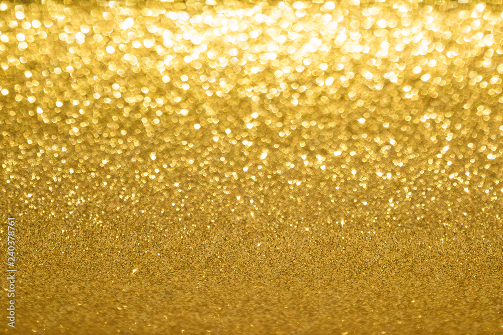 Shining gold glitter background. Abstract texture with bokeh effect. Shining gold glitter background. Abstract texture with bokeh effect.