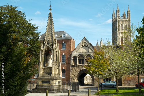 Картината върху платно Picturesque old buildings around St Marys Gate near Gloucester Cathedral in spring sunshine, Gloucestershire, UK