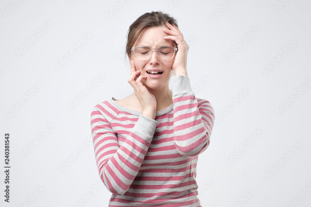 Portrait of displeased upset female frowns face as going to cry, being discontent and unhappy. Dissapointed young woman has troubles Portrait of displeased upset female frowns face as going to cry, being discontent and unhappy. Dissapointed young woman has troubles