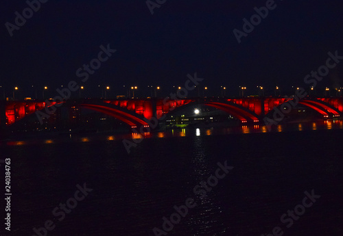 Night bridge over the Yenisei river. Reflection of lights in water. The sights of the city of Krasnoyarsk. © kseny90