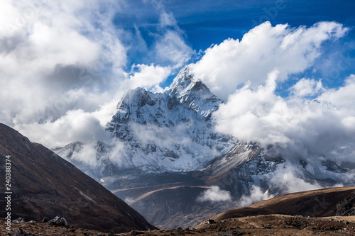 Dramatic mountain view of Ama Dablam summit on the famous Everest Base Camp trek in Himalayas, Nepal. Eminent photo. photo