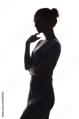 silhouette of a pensive woman with the hand at the chin on a white isolated background, girl make a decision