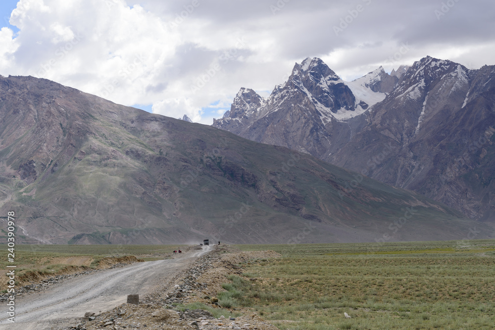Road in Zanskar landscape view with Himalaya mountains covered with snow and blue sky in Jammu & Kashmir, India,