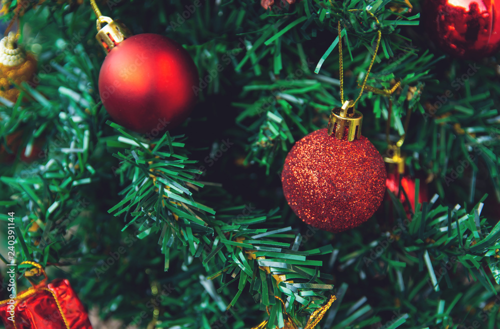 Christmas decoration. Hanging red balls on pine branches christmas tree garland and ornaments. with copy space Christmas decoration. Hanging red balls on pine branches christmas tree garland and ornaments. with copy space