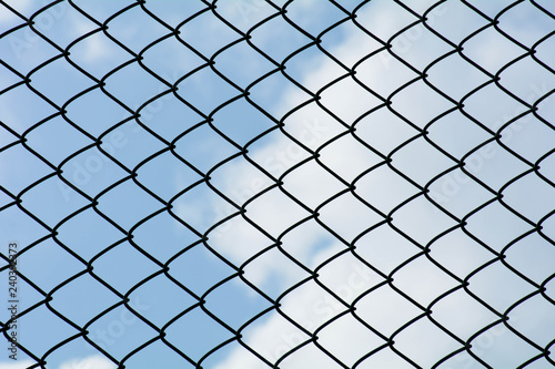 the cage metal net on blue sky background - pattern style