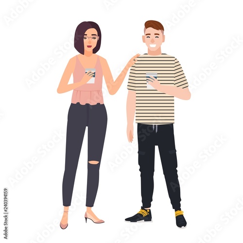 Cute man and woman dressed in casual clothes standing together and drinking coffee
