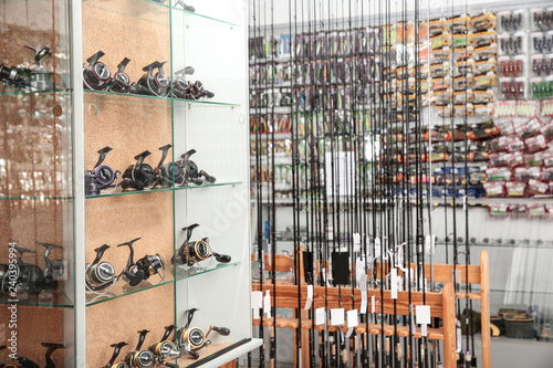 Fishing equipment in sports shop. Recreational activity