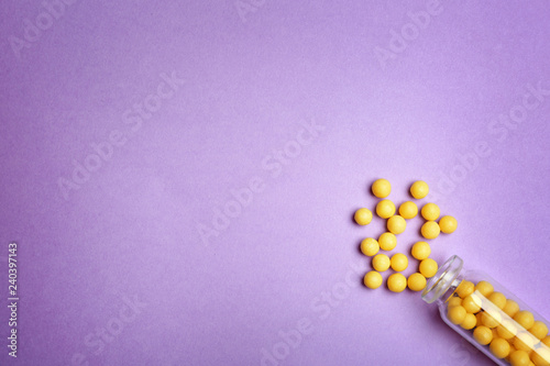 Flat lay composition with pills and space for text on color background. Medical treatment