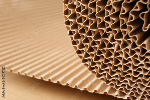Closeup view of roll of brown corrugated cardboard, space for text. Recyclable material photo