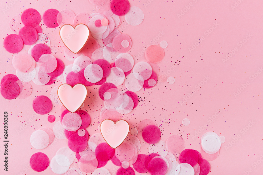 heart with confetti on pink background