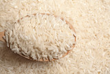 Long grain rice in wooden spoon, closeup view