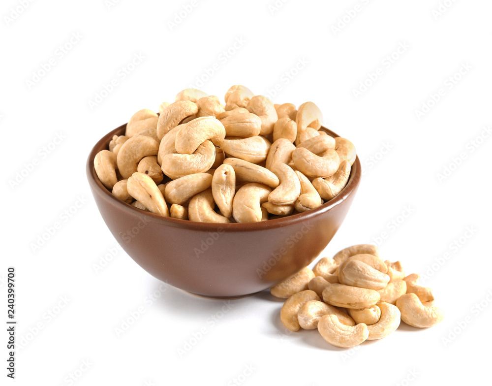 Tasty cashew nuts in bowl isolated on white Tasty cashew nuts in bowl isolated on white