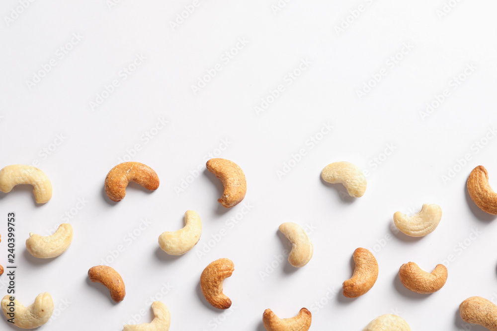 Tasty cashew nuts isolated on white, top view. Space for text