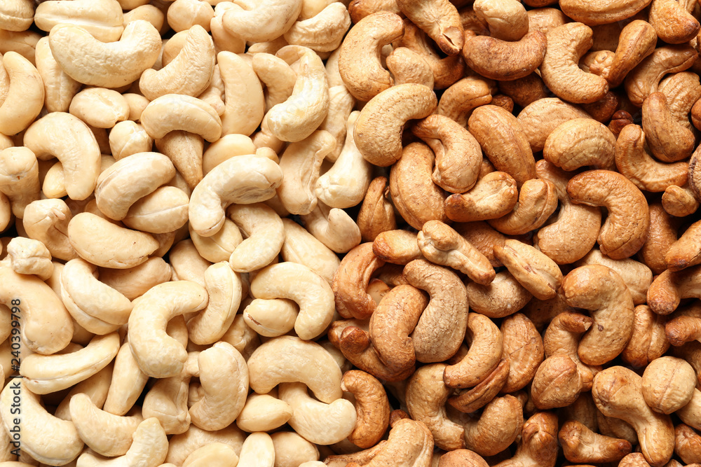 Tasty cashew nuts as background, top view