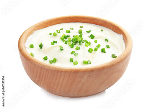 Obraz na płótnie Bowl with sour cream and herbs on white background