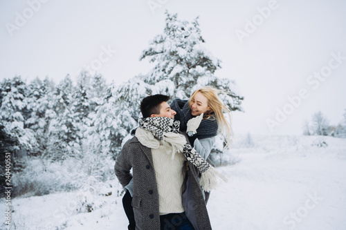 Happy young couple have fun outside in snow park © dsheremeta