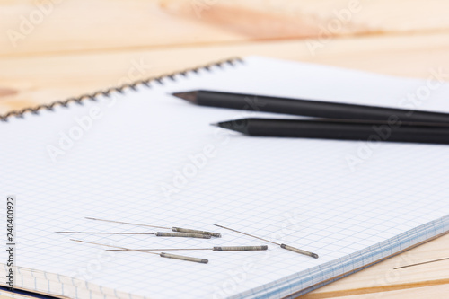Wallpaper Mural Silver needles for traditional Chinese medicine acupuncture lie on a note book, on a wooden table. Torontodigital.ca