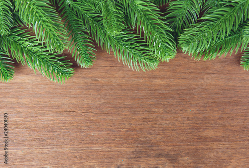 Christmas background. Fir tree branches and with decoration on a wooden board. with copy space for text.