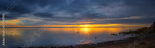 Panorama of the picturesque sunset over the sea