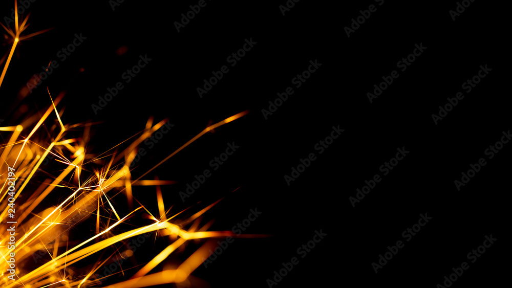 Christmas sparkler isolated on black background. Bengal fire