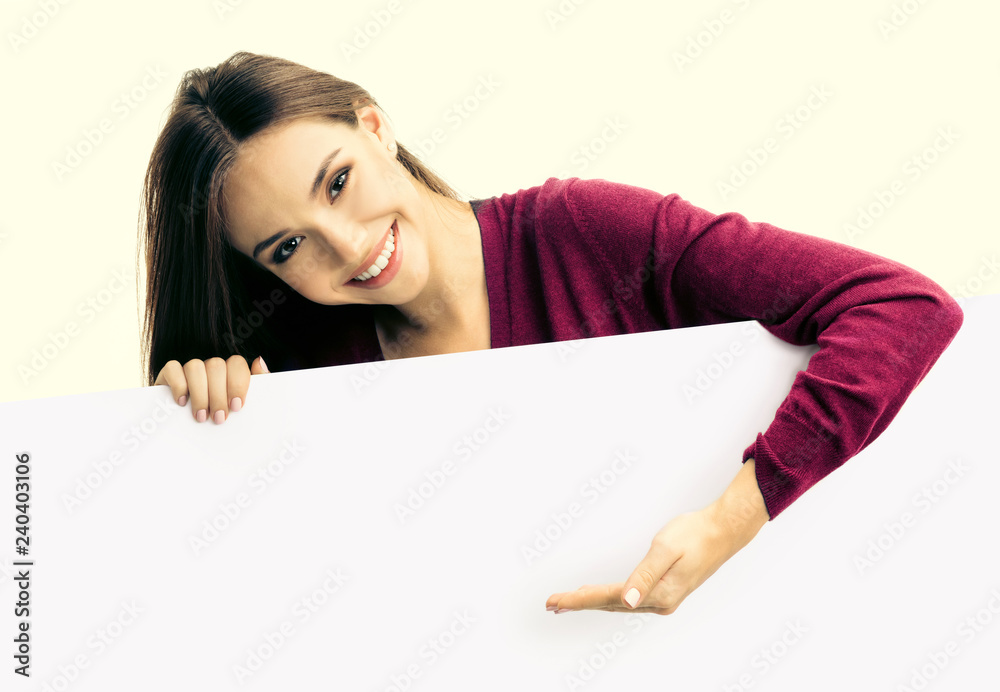 Happy woman showing blank signboard Happy woman showing blank signboard