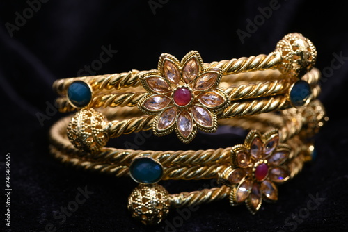 Fancy golden bracelets for woman fashion closeup macro image