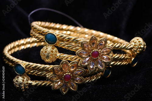 Fancy golden bracelets for woman fashion closeup macro image