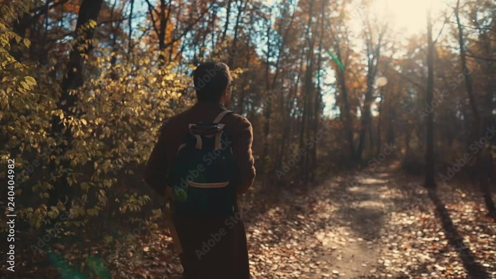 Guy quietly walking in a forest. Guy quietly walking in a forest.