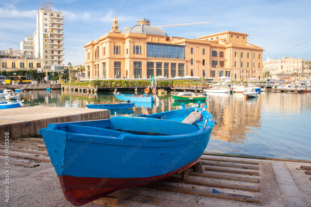 Little Harbor with wooden boats and theater in the background, Bari, Puglia, Italy