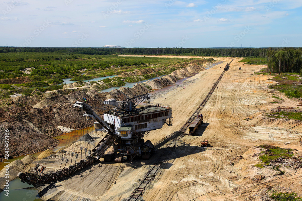Fototapeta premium Top view at mine, railway, mining machinery