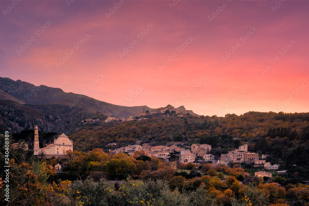 Sunset over mountain villages in Corsica