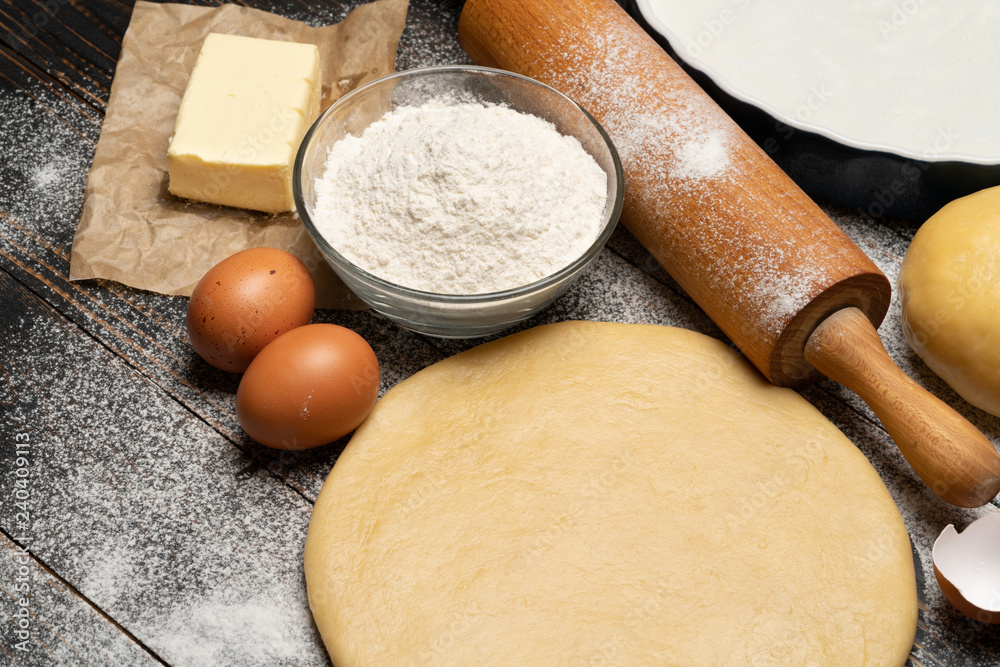 rolled and unbaked Shortcrust pastry dough recipe on wooden background rolled and unbaked Shortcrust pastry dough recipe on wooden background