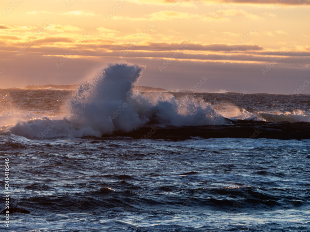 Winter waves at Peggy's Cove in Nova Scotia during sunset, peaceful, waves, powerful.