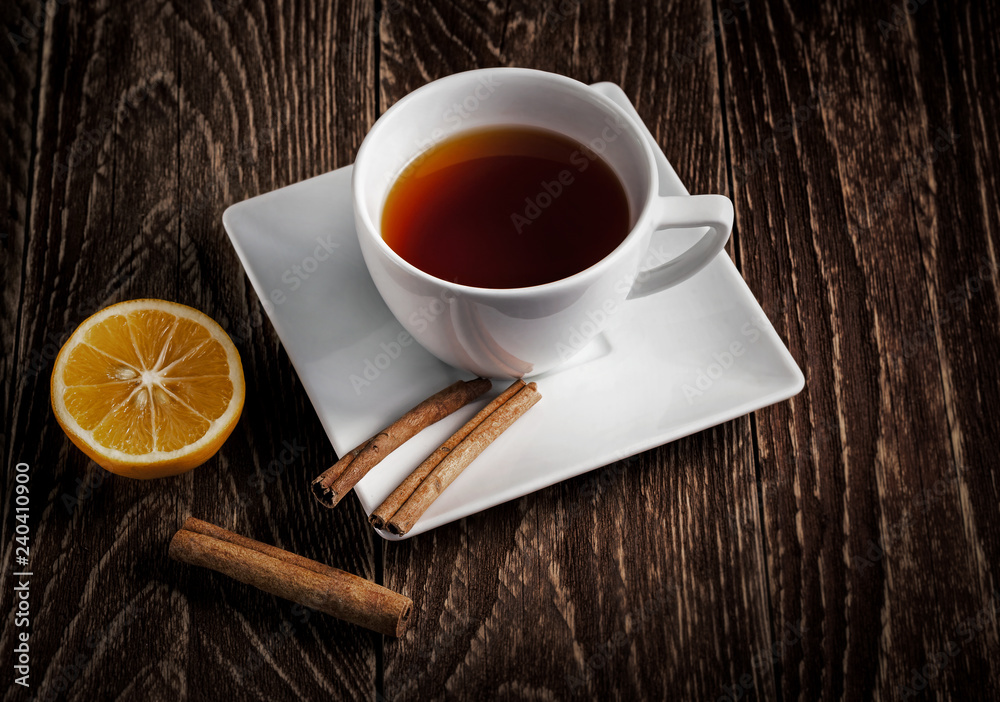 cup of tea with lemon on wooden table cup of tea with lemon on wooden table
