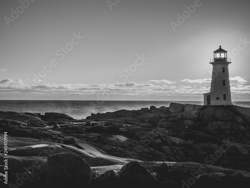 Peggy's Cove lighthouse at sunset in the winter, tourist, cold, Atlantic Ocean, seaside